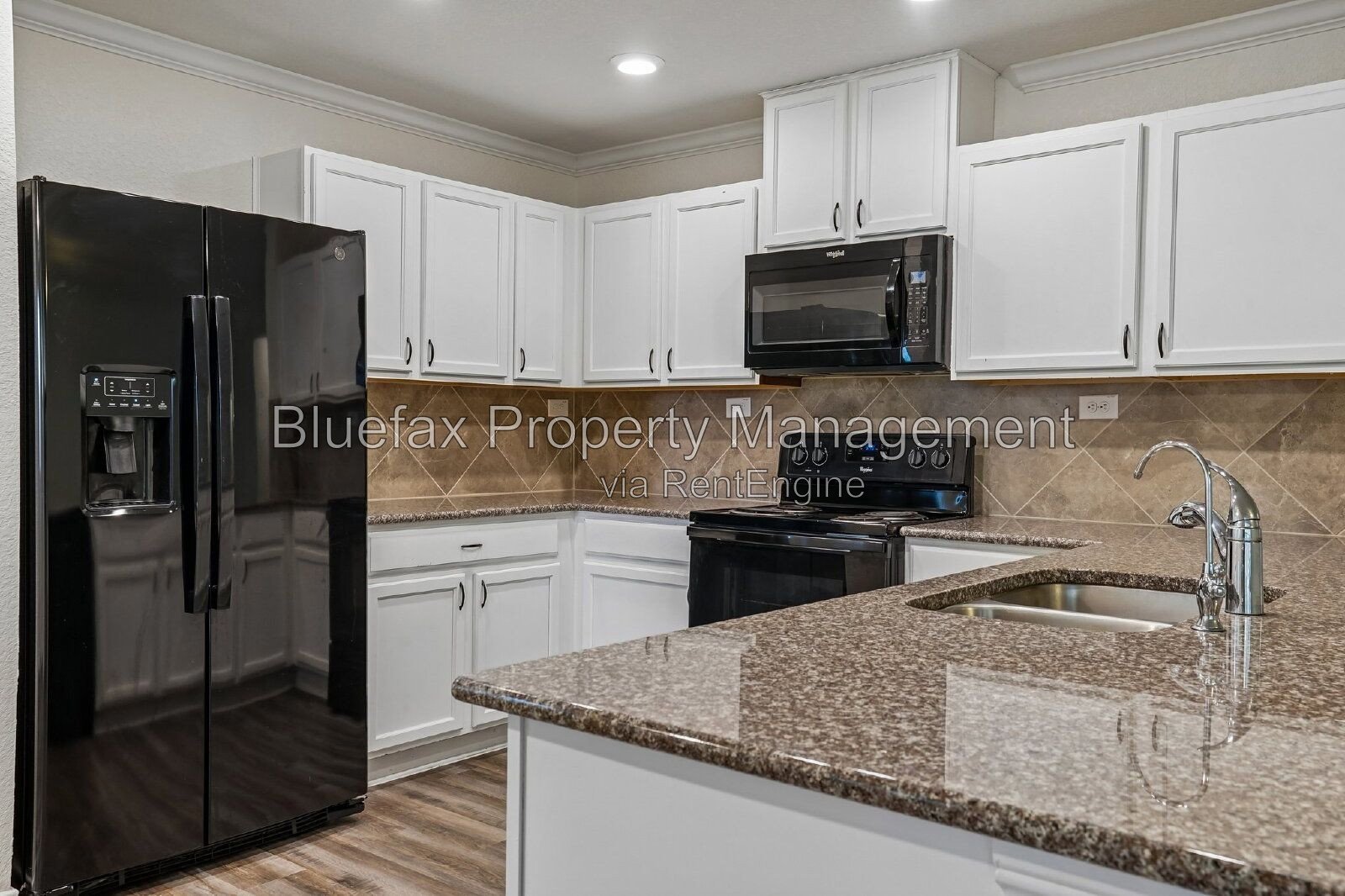 HUGE Covered Patio with Built In Counters, a Refrigerator and a Place for Your Grill! property image