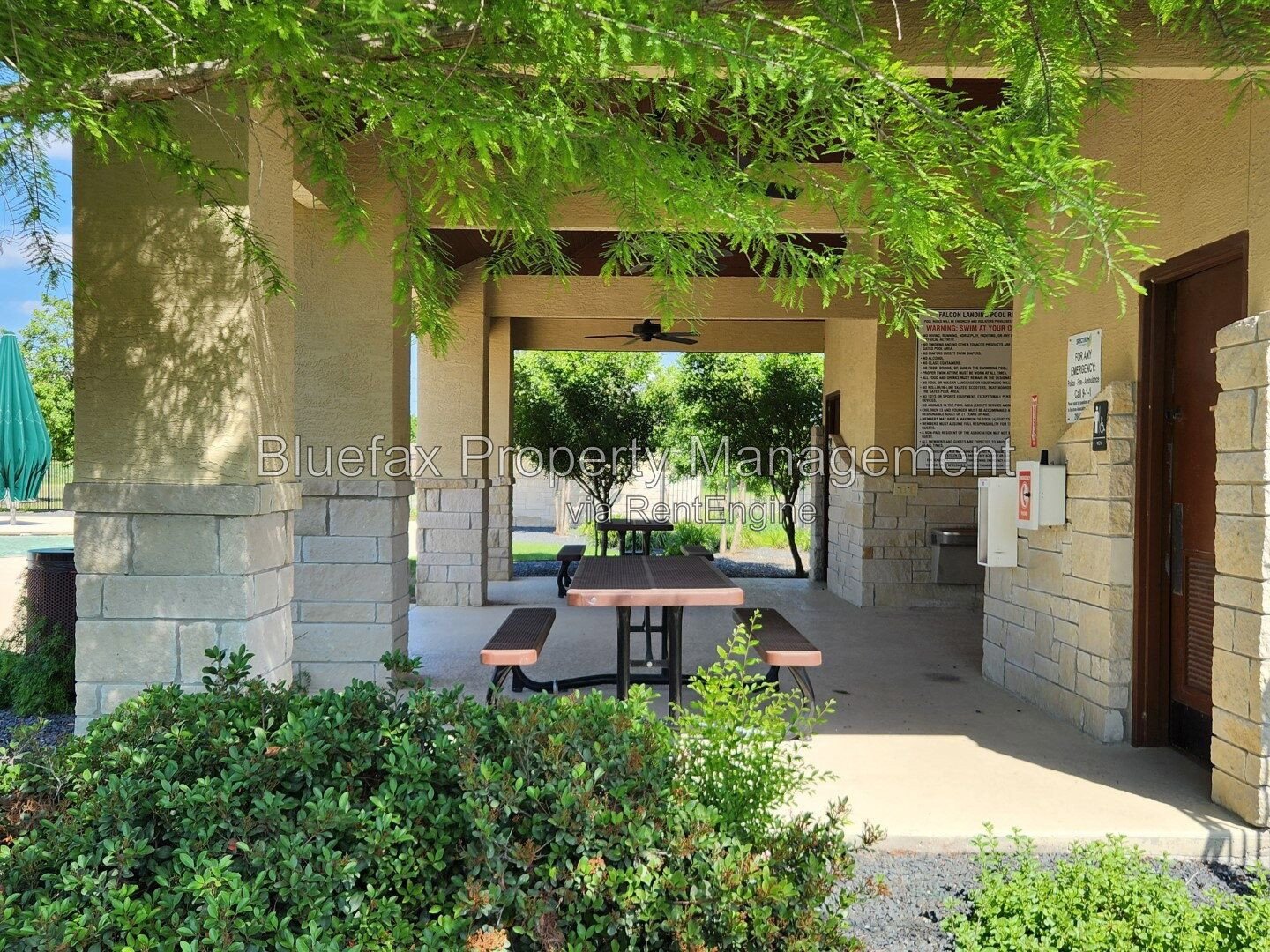 HUGE Covered Patio with Built In Counters, a Refrigerator and a Place for Your Grill! property image